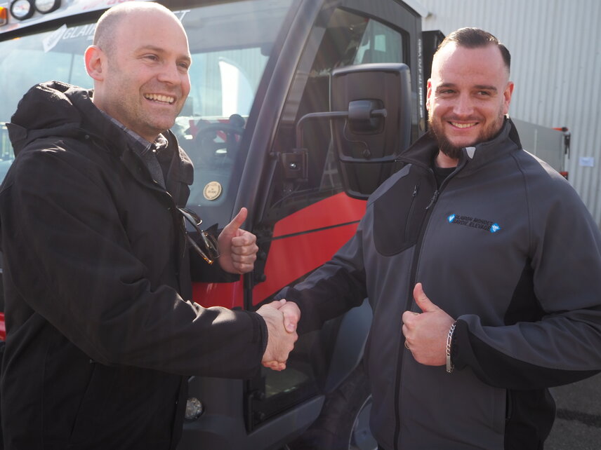 Philipp Hohl, Head Aebi Global at Aebi Schmidt and Quentin Glairon-Mondet in front of the anniversary vehicle. 